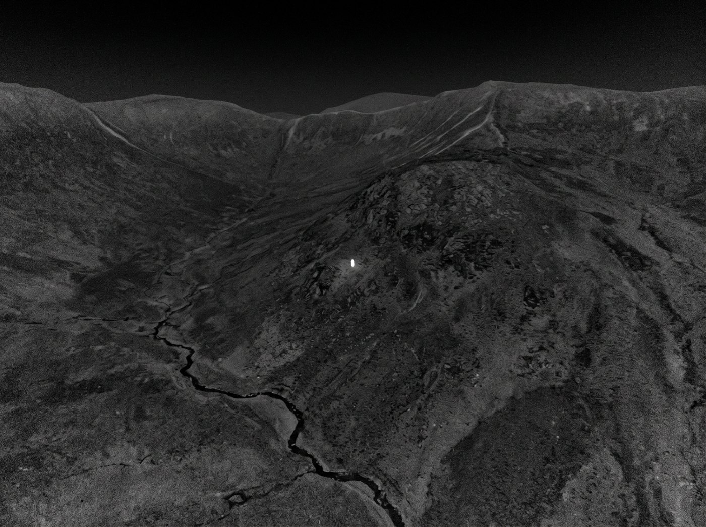 Thermal imagery of a person on a mountainside at night